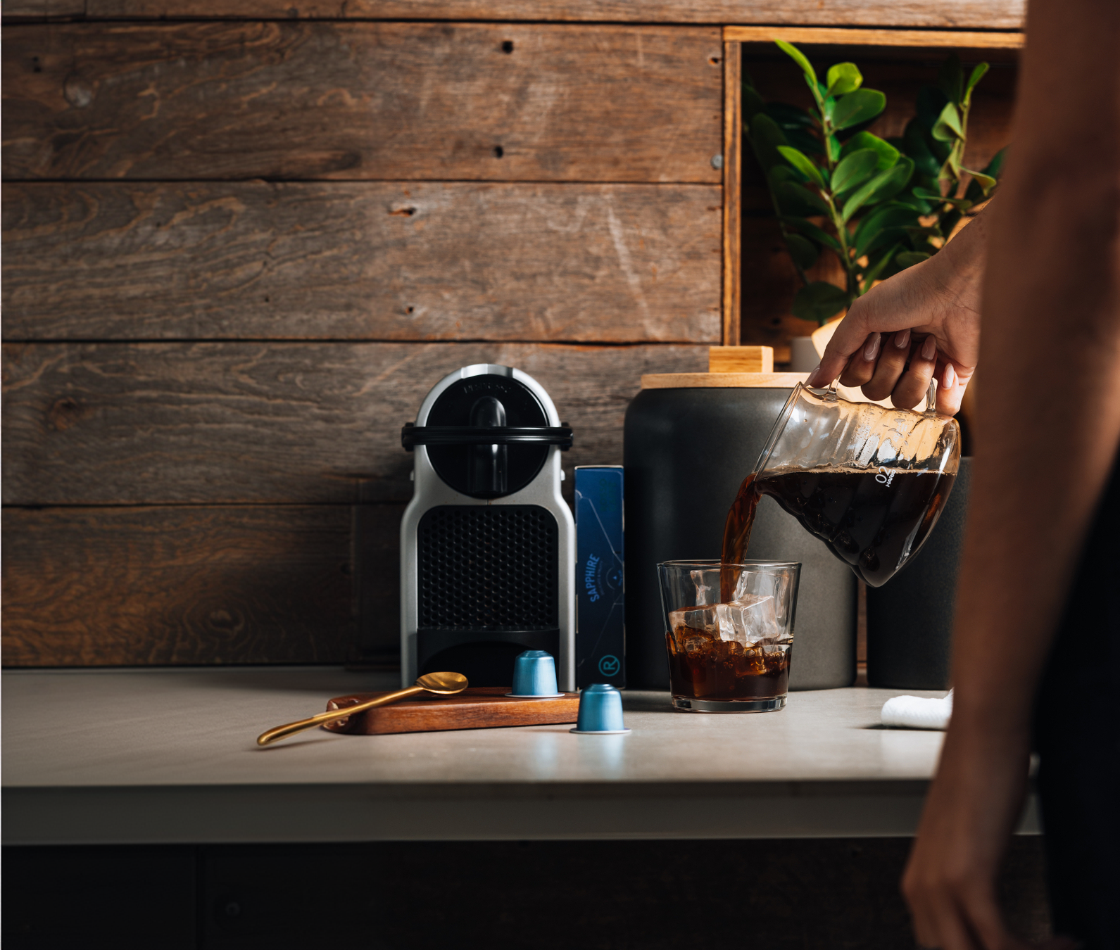 Rosso espresso capsules with iced coffee being poured